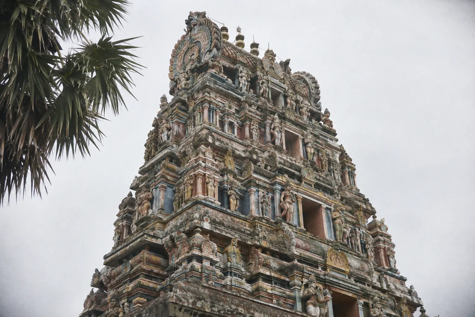 Painted gopuram tower of a Hindu temple in Jaffna seen from below